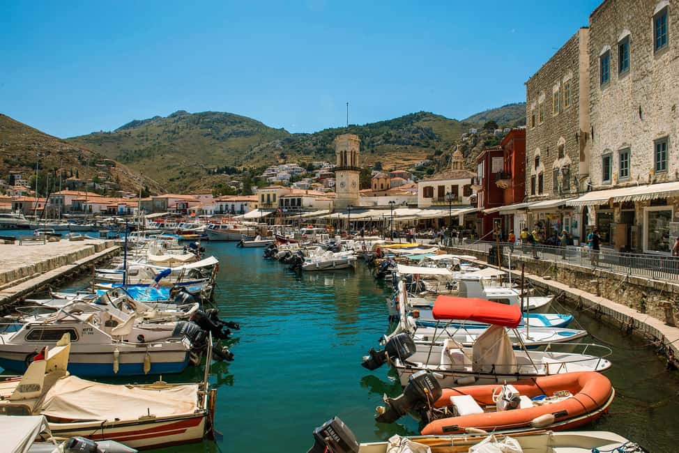 Athens Day Cruise – Since 1965 | Visit Hydra, Poros & Aegina - Lunch onboard and the return-party feel: buffet food, bar drinks, and Greek artists