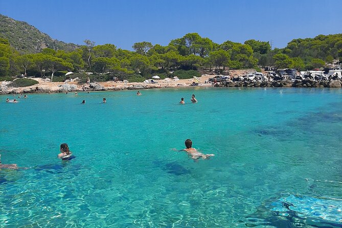 Athens: Full-Day Island Hopping Cruise with Lunch and Swimming - The crew and onboard atmosphere: clean boat, safety focus, real people