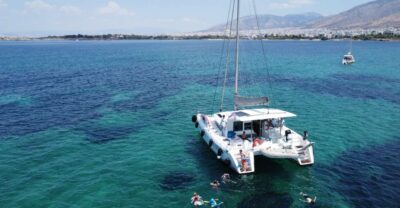 Athens Riviera Private Catamaran Cruise with Meal and Drinks - Cruising the Athens Riviera before the first swim stop