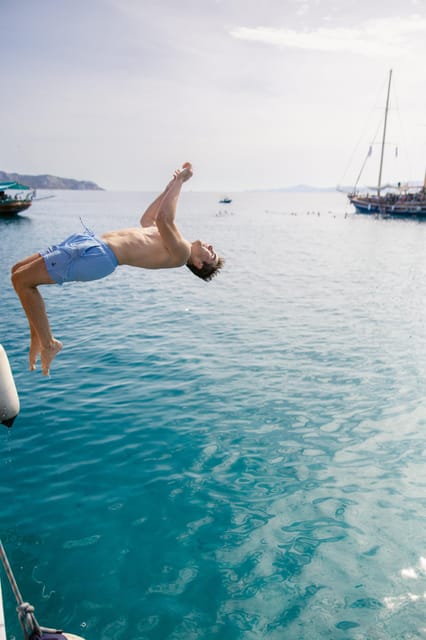 Sunset Dinner Cruise: Swim Stop, Drinks & Onboard Dining - Marina Zeas Pier D and Finding the CALYPSO Fast